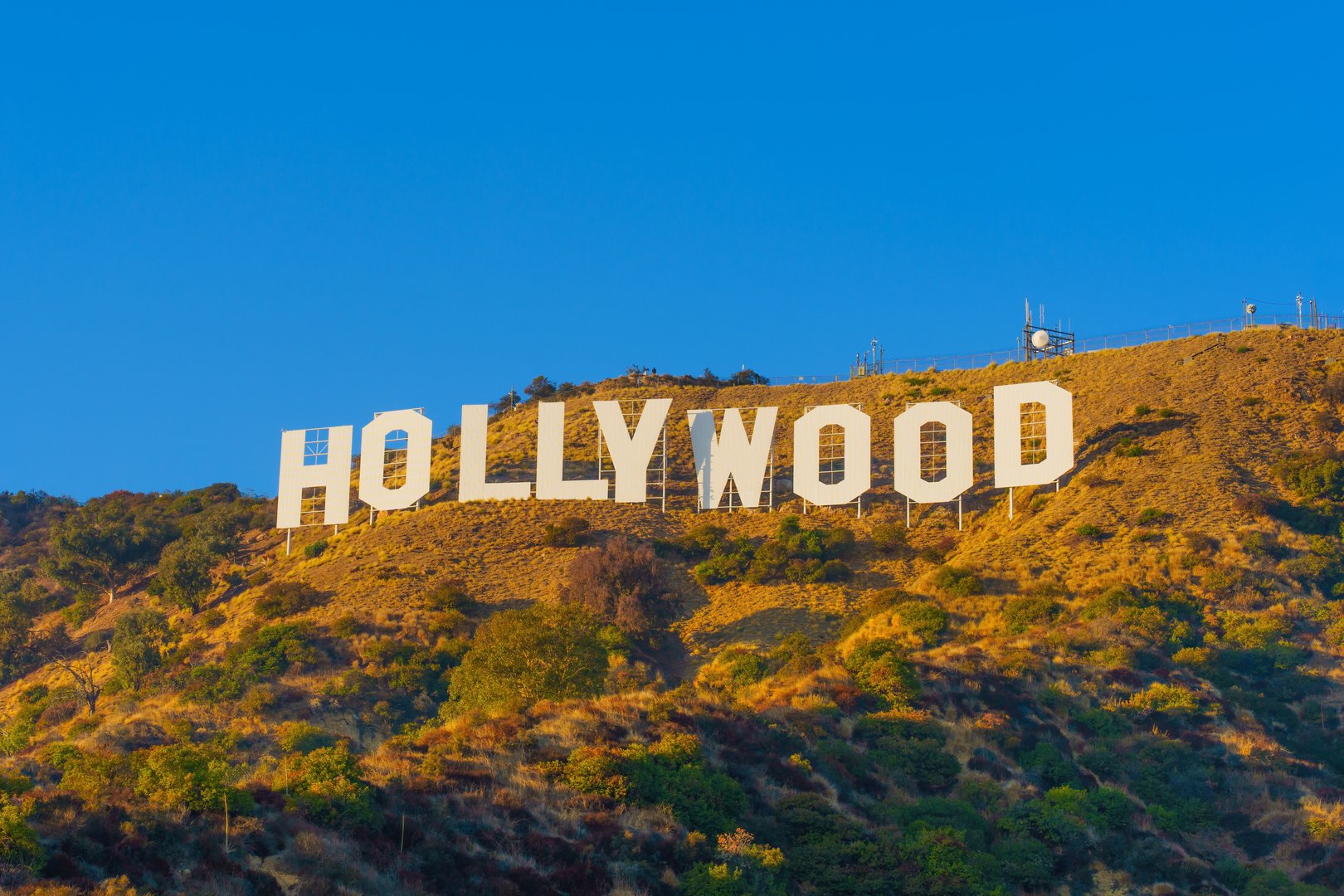 Iconic Hollywood Sign on the hillside at sunset representing the Los Angeles, California service area