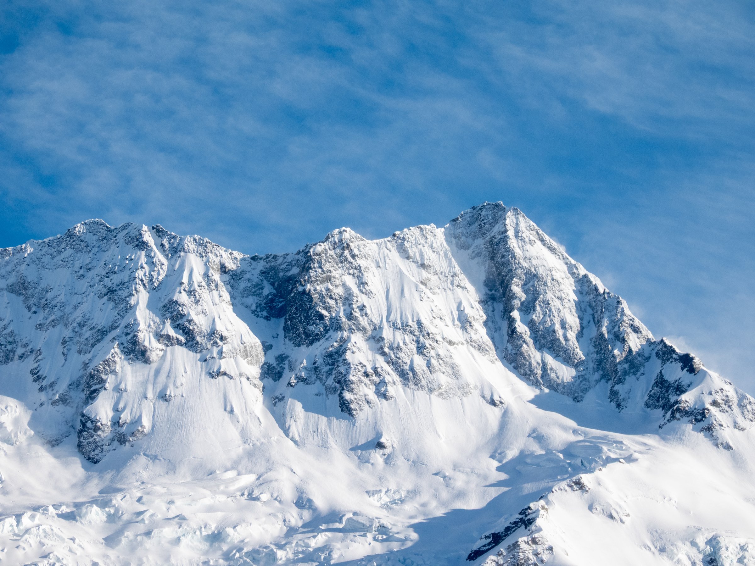 Snow-capped Rocky Mountain skyline at sunrise representing Denver, Colorado service area