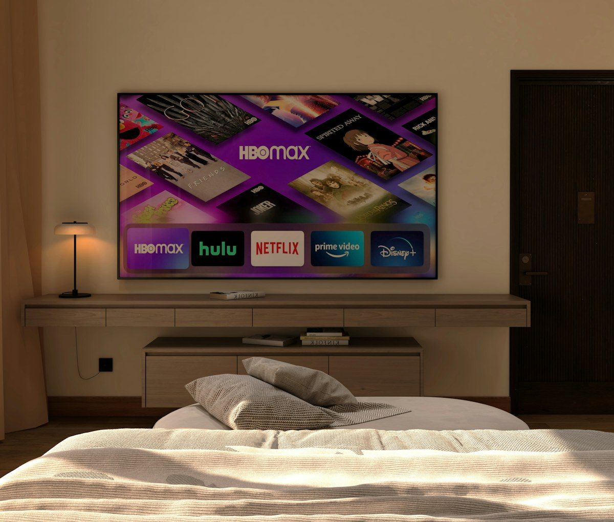 Bedroom with a large wall-mounted TV above a low shelf