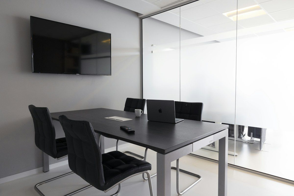 Small meeting room with a TV mounted on the wall