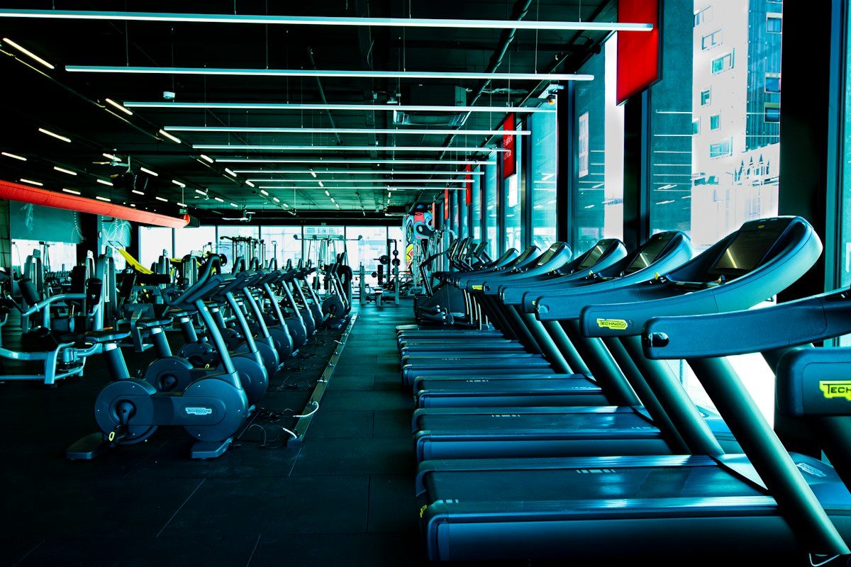 Gym with a long row of treadmills