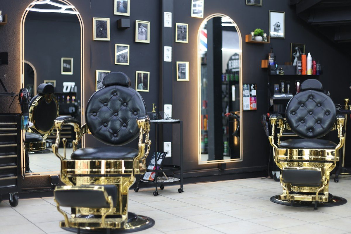 Barbershop with gold and black barber chairs