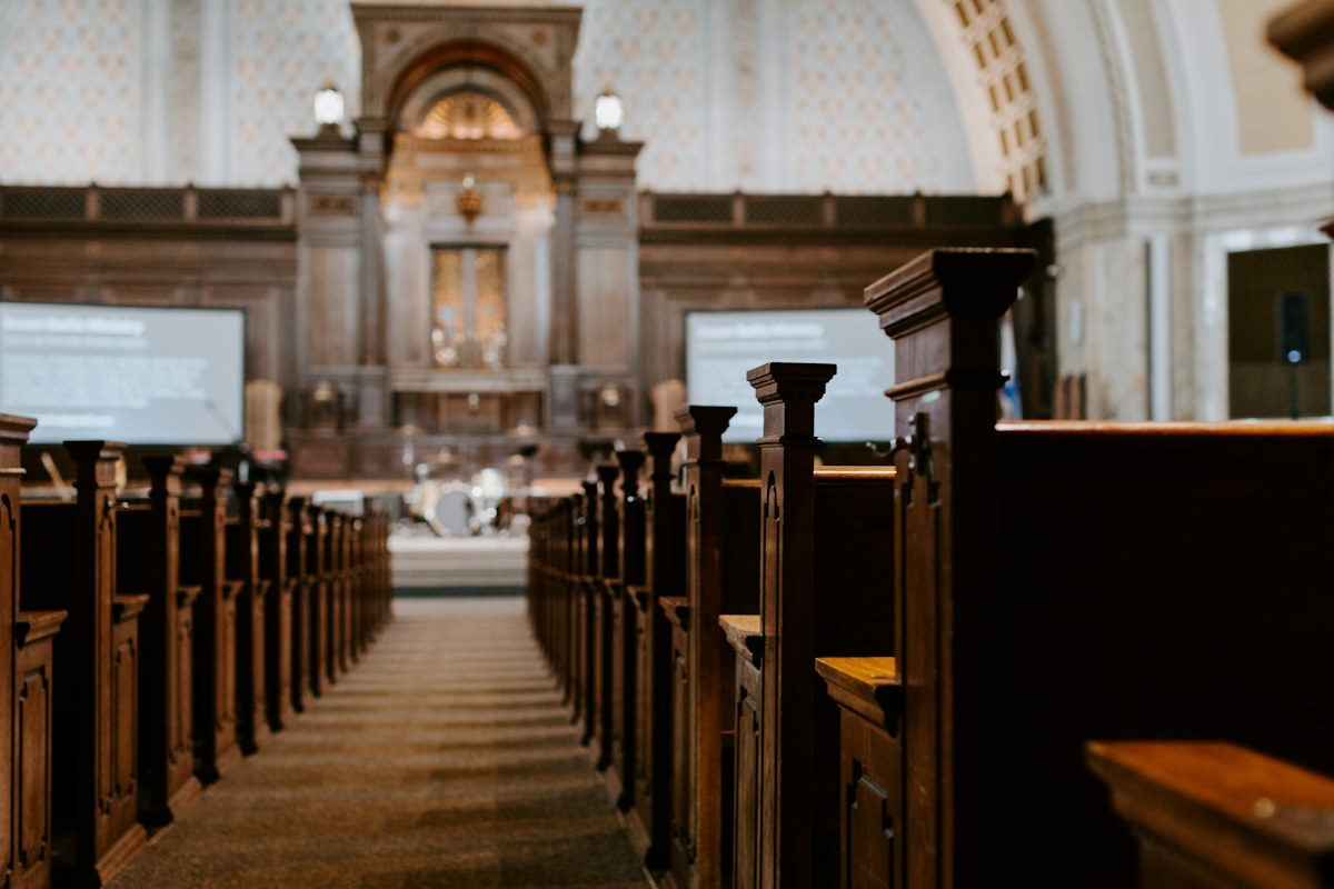 Church sanctuary with screens on both sides of the altar