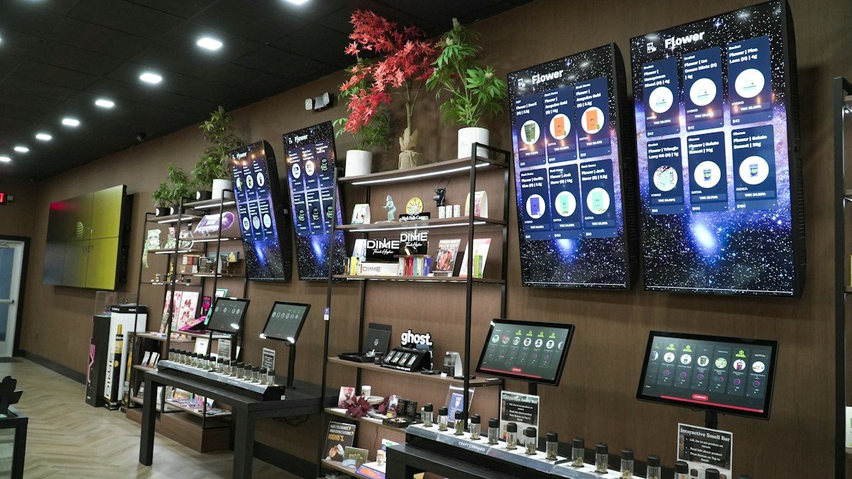 Store with product screens mounted along the wall