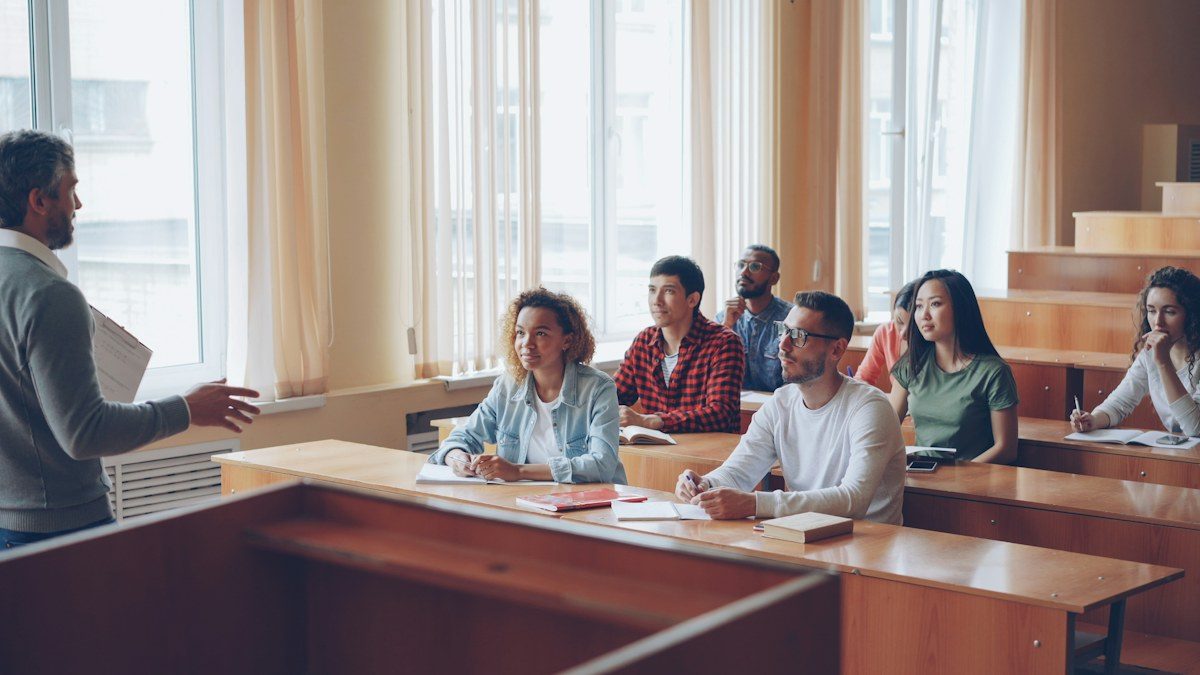 Teacher speaking to students in a classroom