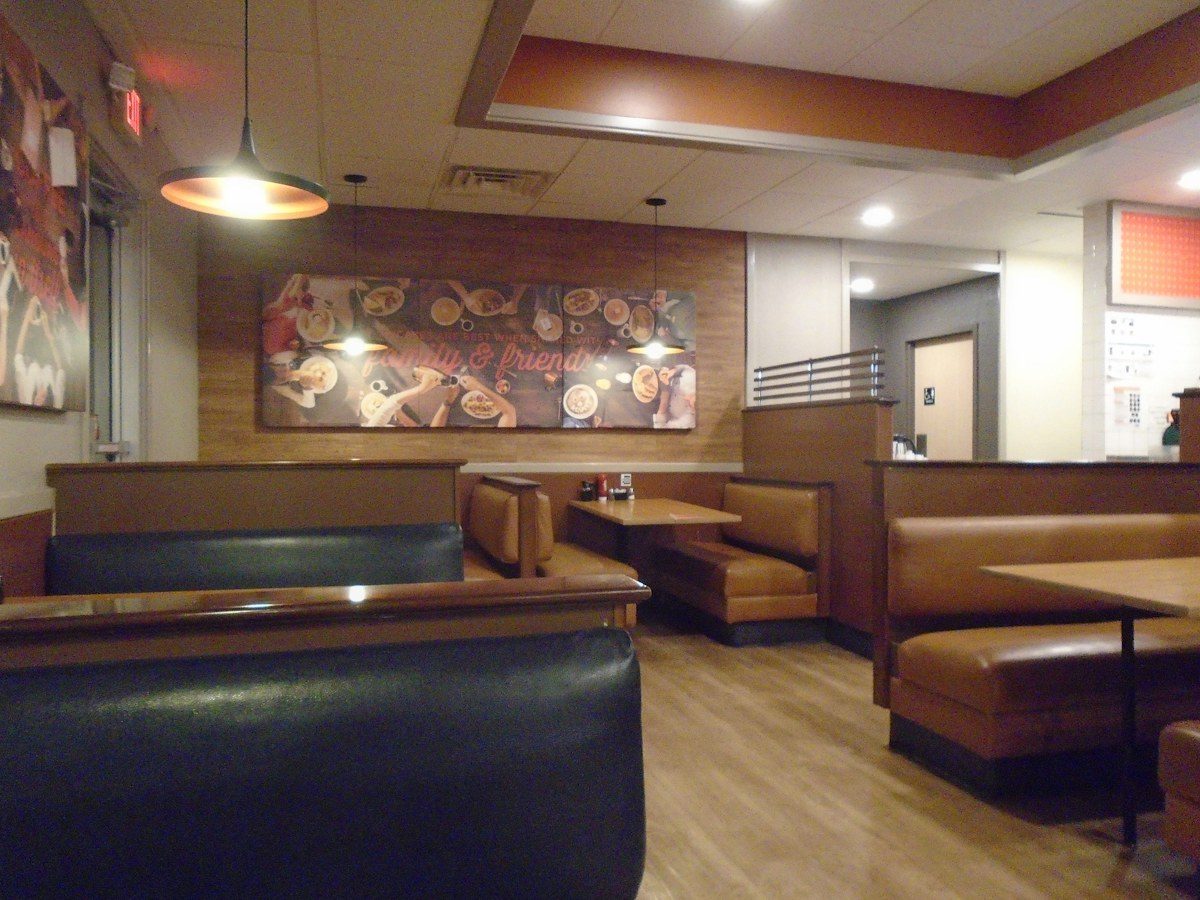 Restaurant dining room with booth seating