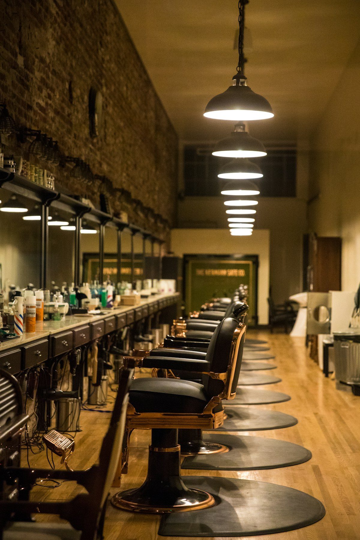 Long barbershop with a row of barber chairs