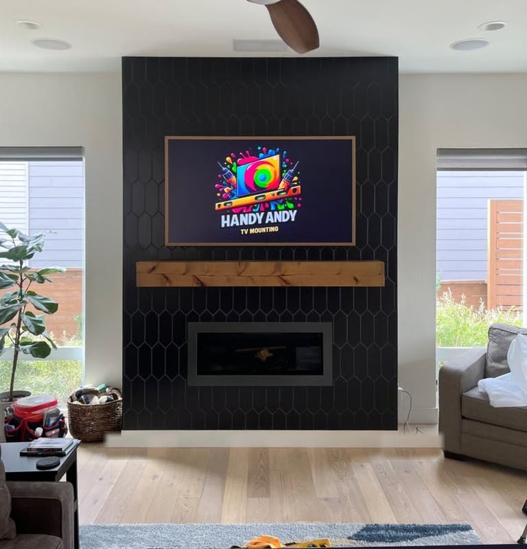 TV mounted on a black hexagon-tile fireplace wall above a wood mantel